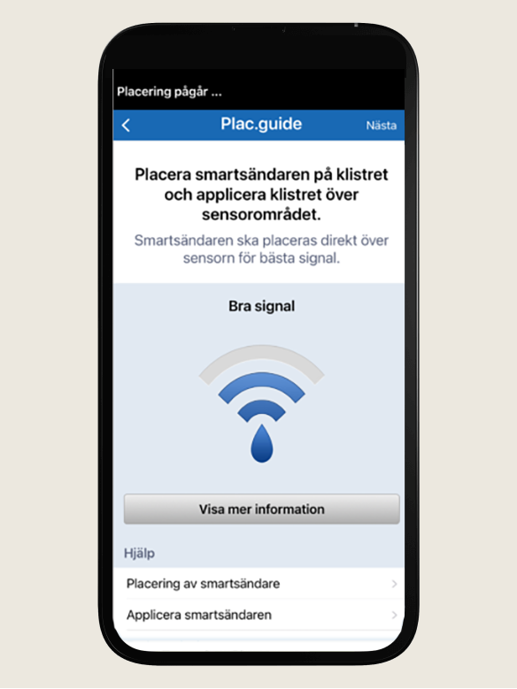 "Smartphone visar en medicinsk apps placeringsguide, med signalinstruktioner och en &rdquo;Visa mer detaljer&rdquo;-knapp nedan.  "